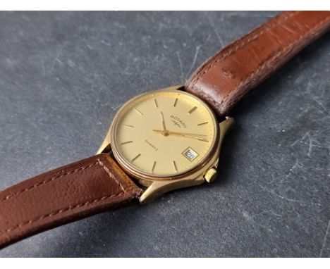 A Rotary gold plated quartz wristwatch, 33mm, on brown leather strap. 