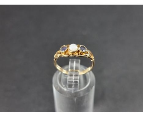A 9ct gold opal and sapphire ring. 