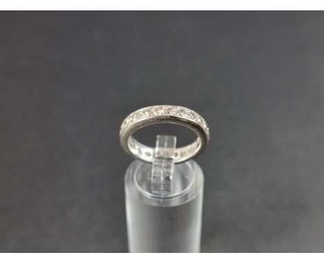 A white metal diamond eternity ring, stamped&nbsp;750, size M 1/2. 