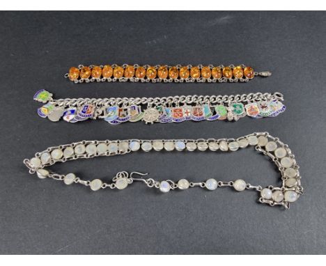 A white metal bracelet, set amber, stamped 925, 18cm; together with a white metal necklace, set cabochon moonstones, 42cm; an