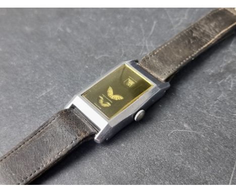 An unusual vintage Swiss jump hour manual wind tank wristwatch, probably by Helvetia,&nbsp;23 x 32mm, the dial with apertures