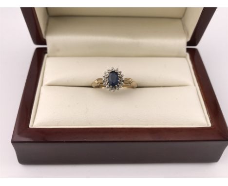 A 9ct diamond and sapphire ring. Approx weight 2.27 grams, approx size K.