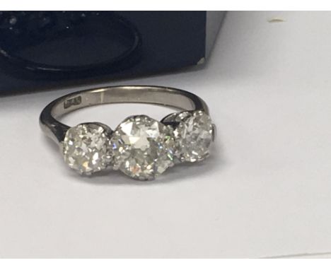 A platinum ring inset with three diamonds total weight 2ct Approx .Size L