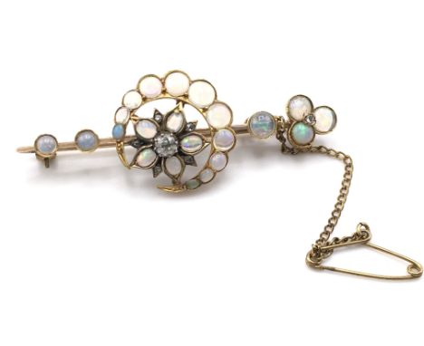 An Edwardian opal and diamond crescent moon and flower brooch. High carat gold.Postage A