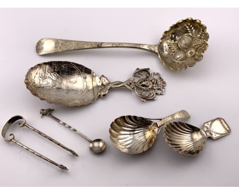 A small collection of hallmarked silver cutlery to include a Paul Storr berry spoon, A sterling silver Dutch caddy spoon, 2 G