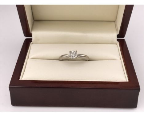 An 18ct white gold illusion set diamond ring. Approx weight 3.59 grams, approx size O.
