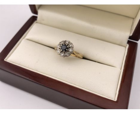 An 18ct diamond and sapphire heart cluster ring. Approx weight 3.75 grams, approx size L.