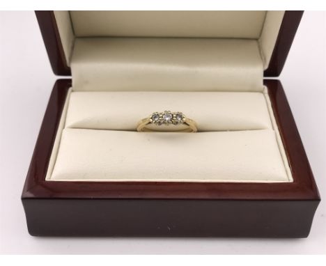 An 18ct gold 3 stone diamond ring. approx weight 3.04 grams, approx size L.