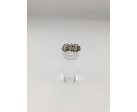 An 18ct diamond cluster ring Approx weight 3.22 grams , Approx size J.