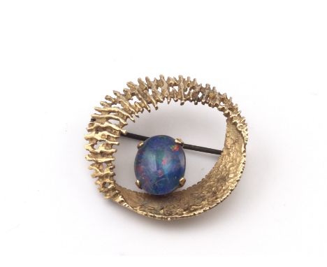 A 9ct gold brooch set with opal. 5.22g and approx 30mm diameter. Postage B