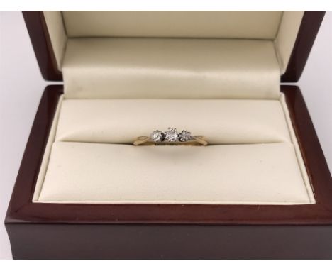 A three stone 18ct diamond ring. Approx weight 2.09 grams, approx size Q.