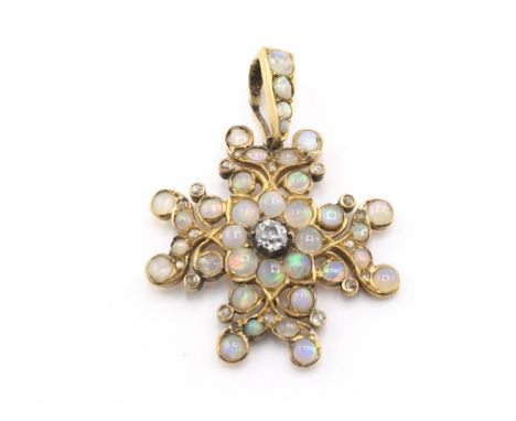 An Edwardian high carat opal star pendant set with central diamond. Approximately 0.35/0.40 ct.Postage B