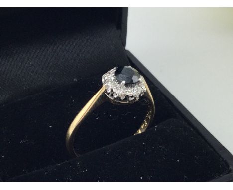 An 18ct gold sapphire and diamond set ring. Approx weight 2.7 grams, size P.