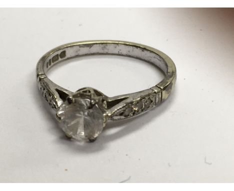 A 9 ct white gold ring inset with single diamond.siz L / M .