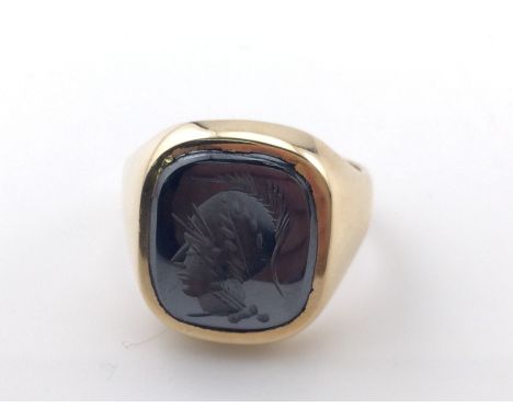 A 9k gold Hematite signet ring. Size R and 8.25g Postage A