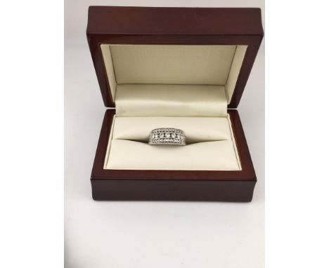 A white metal ring( tested 18ct not hallmarked) set with diamonds. Approx weight 9.63 grams, size O.