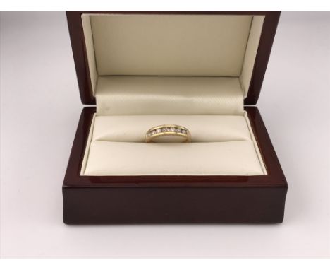 An 18ct diamond set half eternity ring approx diamond weight 0.50cts. Approx weight 2.9grams, approx size L1/2.