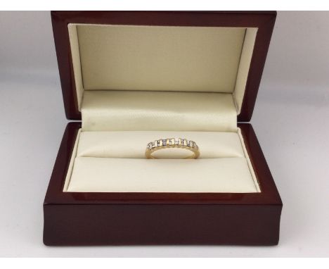 An 18ct diamond set ring with baguette and brilliant cut diamonds.