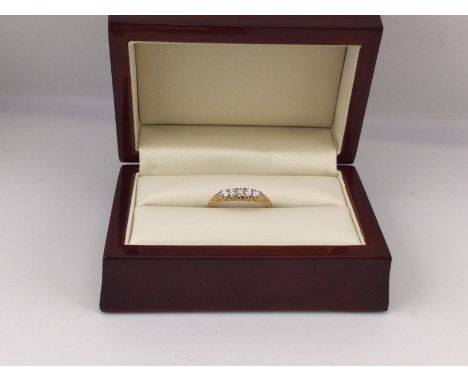 An 18ct gold diamond set five stone ring. Approx weight 2.3grams, approx size P.
