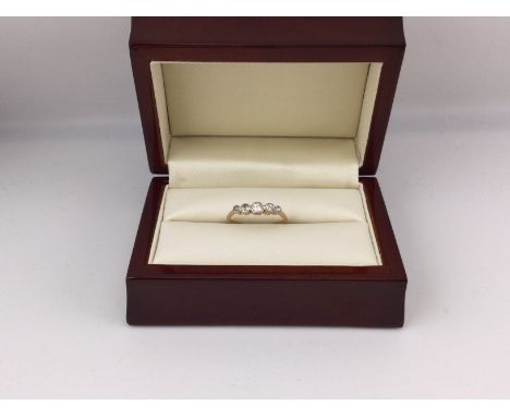 An 18ct gold five stone diamond ring. Approx weigh 1.9grams, approx size O.