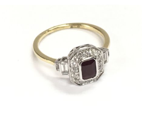 18ct white and yellow gold art deco style ring set with step cut ruby surrounded by diamonds. Ruby 0.60ct diamonds 0.41ct. Si