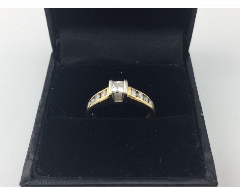 An 18ct gold princess cut diamond ring. Approx weight 3.7 grams, approx size I.