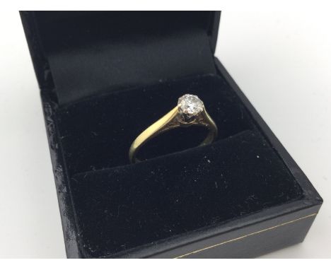 An 18ct gold diamond set solitaire ring. Approx weight 2.2 grams, approx size k1/2.