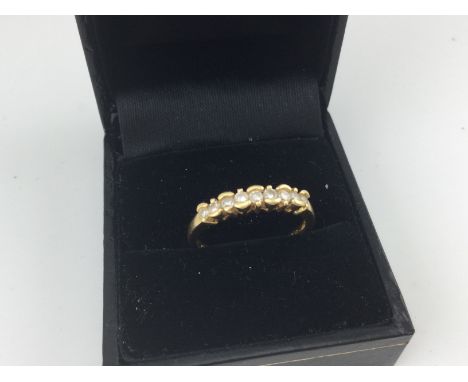 An 18ct gold diamond rub set ring. Approx weight 3.00 grams, size Q.