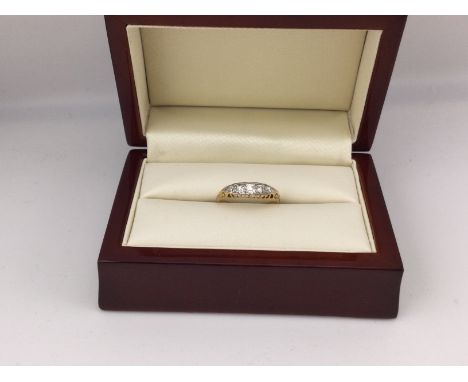 An 18ct gold five stone old cut diamond set ring. Approx weight 2.6grams, size L.