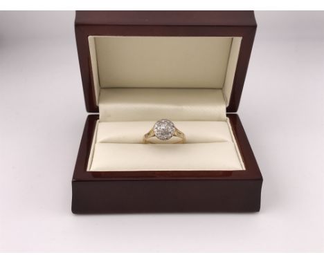 An 18ct gold diamond cluster ring approx weight 3.7grams, approx size R.