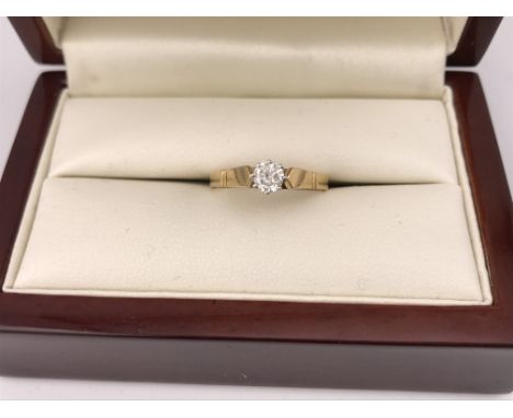 An 18ct gold diamond set solitaire ring. Approx size N, approx weight 2.8 grams.