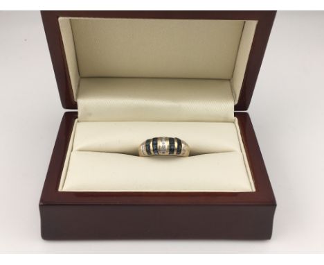 A 9ct gold diamond and sapphire ring. Approx weight 2.97 grams, Approx size L1/2.