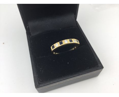An 18ct gold diamond and sapphire ring approx weight 3.1 grams, approx size n.