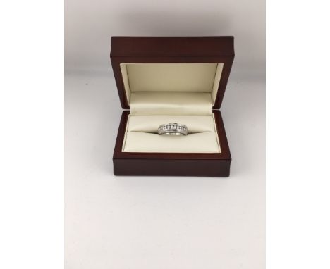 A 9ct white gold diamond set ring. Approx weight 6.2 grams, Approx size Q.