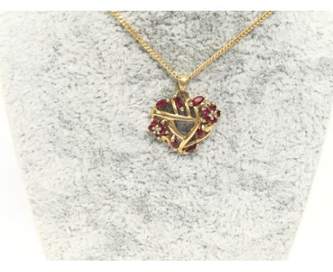 9ct gold ruby and diamond chip pendant on chain. Postage A