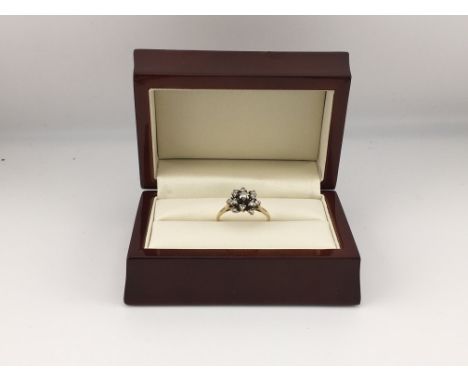 An 18ct diamond cluster ring. Approx weight 3.73 grams, Approx size Q 1/2.