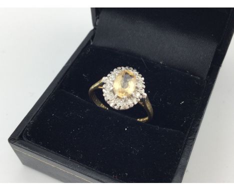 An 18ct gold stone set ring. Approx weight 3.5 grams, size M.