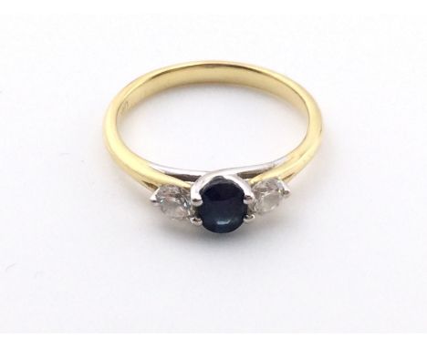 An 18k gold sapphire and diamond ring. 2.44g and size K 1/2.Postage A