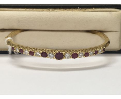 A 18 ct  bracelet inset with ruby and diamond total weight 15.48 grams fitted in original box .
