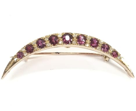 An antique 9 carat gold ruby and diamond crescent brooch, 5g postage category A