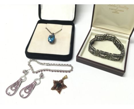 Silver and ruby earrings & matching bracelet, silver marcasite bracelet, silver red gemstone set star pendant, blue stone pen