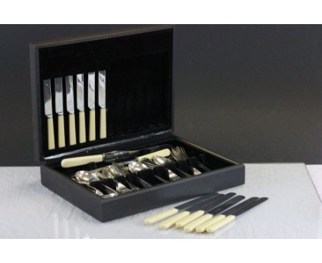 A cased set of silver plated flatware.