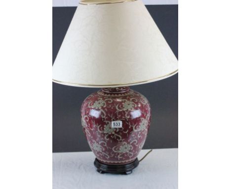 A vintage oriental purple ground ovoid lamp with shade.
