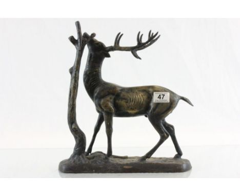 After Mene  large bronze sculpture of a deer by tree unsigned.