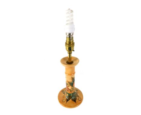 A Moorcroft pottery lamp base, formed as a candlestick, decorated with birds and fruit. 