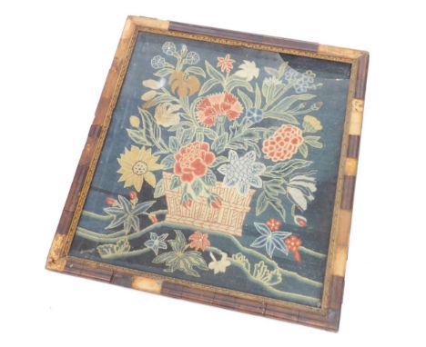A late 18thC floral tapestry, set with basket of flowers decorated in colours predominantly in yellow, green, red and blue, 5
