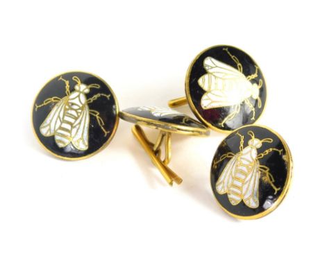 A set of glass and enamel collar studs, each with black enamel detailing, with central B design in white enamel picked out in