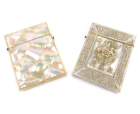 A Victorian mother of pearl card case, the rectangular body raised with flowers, with further floral and scroll panels, 11cm 