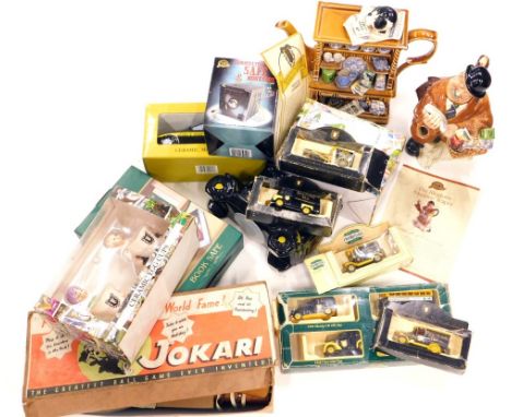 Various Ringtons Tea teapots, a Jokari vintage game, partially boxed, various die cast Ringtons Tea vans, 5cm high, etc., oth