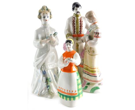 Various Ukrainian porcelain figures to included courting couple, polychrome decorated in green and pink, 28cm high, another f